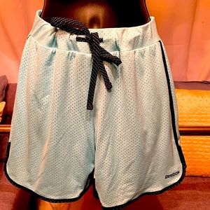 Running Reebok shorts, light blue